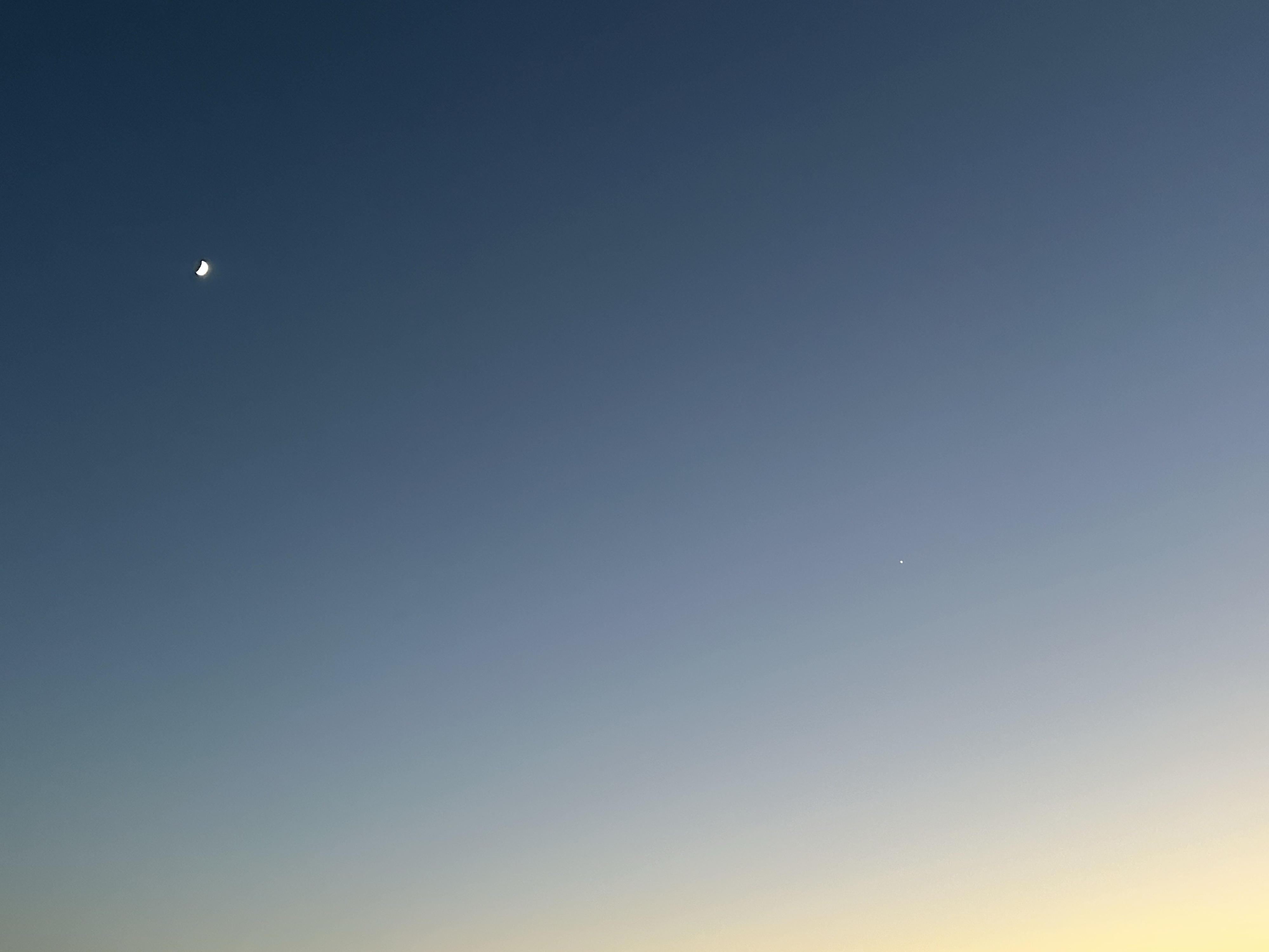 Yellow to blue diagonal ombre with tiny half moon. iPhone no edits.
